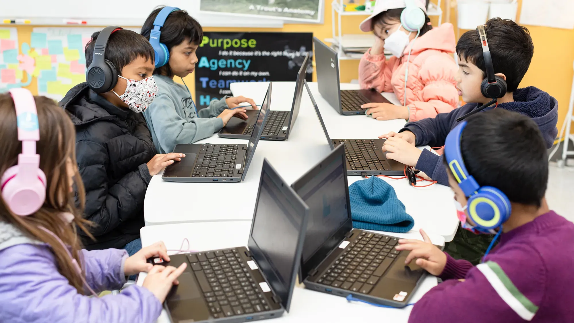 Student using an AI learning tool responsibly with teacher guidance